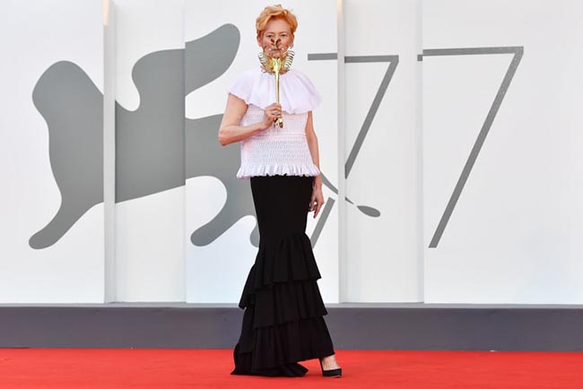 Tilda Swinton arrives for the festival's opening ceremony and first screening.jpg