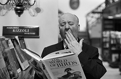 alfred-hitchcock-yawning-over-book-of-birds-at-the-rizzoli-bookstore-on-new-yorks-fifth-avenue-ny-1965.jpg